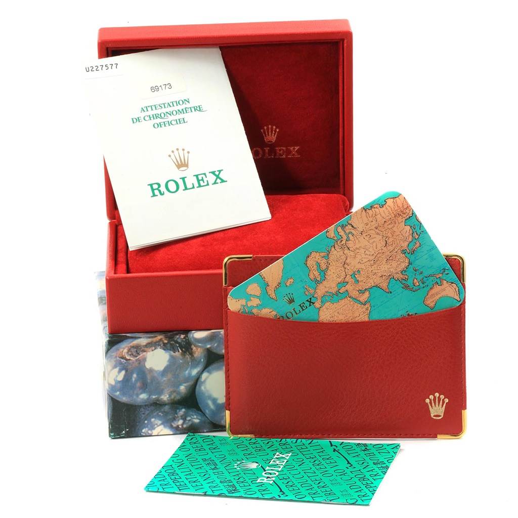The image features a Rolex Datejust 69173 Women's Stainless Steel Black Dial 69173 Women's Stainless Steel Black Dial watch box, warranty booklet, a cardholder, and a map-themed card.