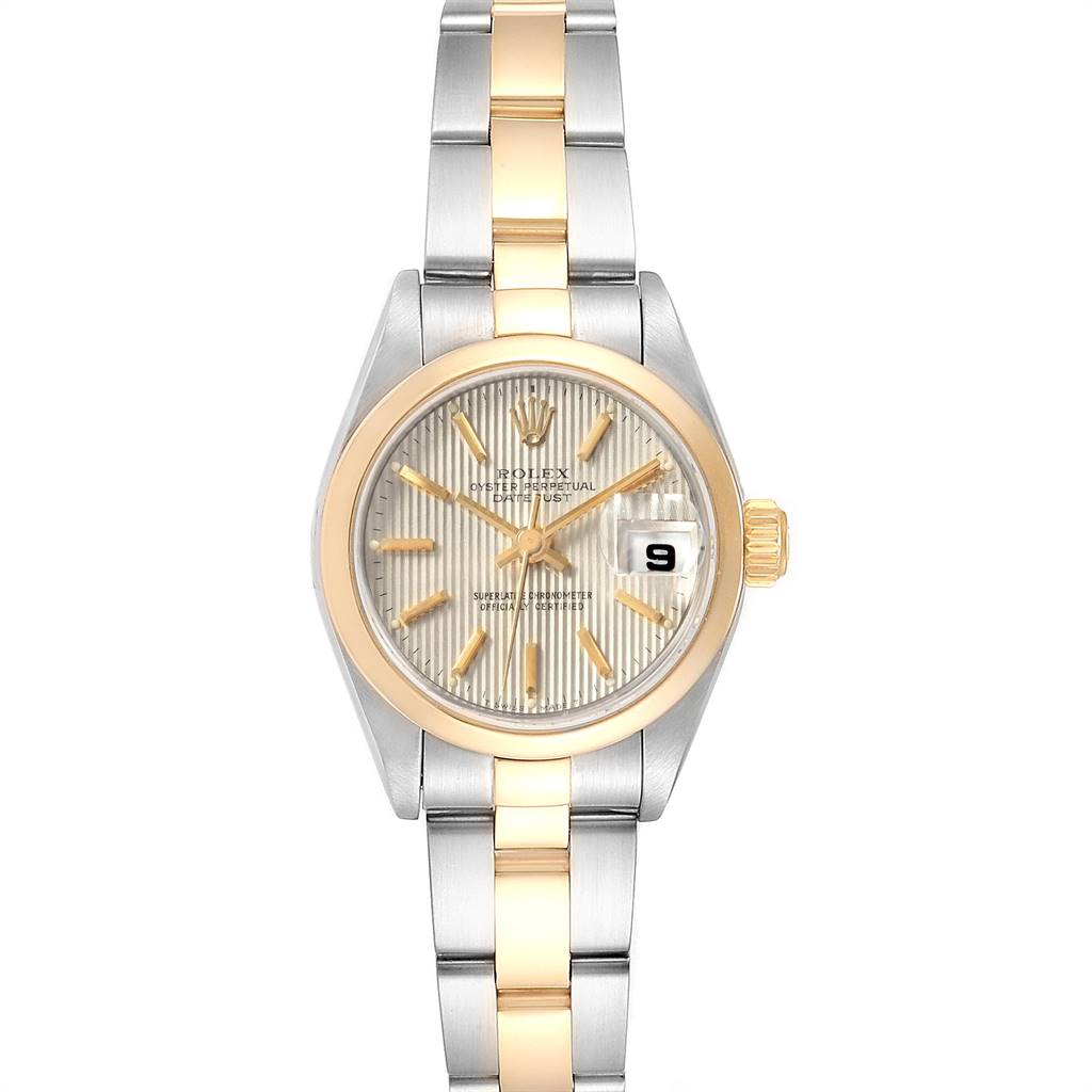 The Rolex Datejust 79163 Women's Steel and Gold (two tone) Silver Dial 79163 Women's Steel and Gold (two tone) Silver Dial watch is shown from the front, displaying its dial, bezel, and part of its two-tone bracelet.