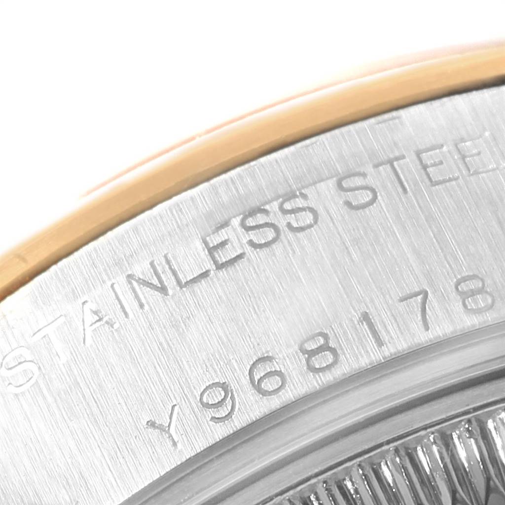 This is a close-up image of the stainless steel casing and serial number of a Rolex Datejust 79163 Women's Steel and Gold (two tone) Silver Dial 79163 Women's Steel and Gold (two tone) Silver Dial watch.