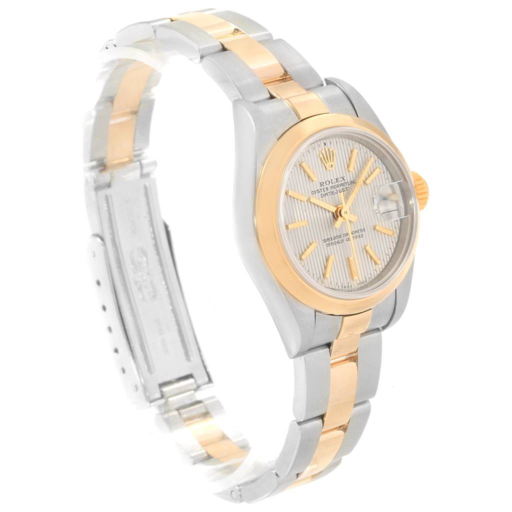 The Rolex Datejust 79163 Women's Steel and Gold (two tone) Silver Dial 79163 Women's Steel and Gold (two tone) Silver Dial watch is shown from a three-quarter angle, displaying its two-tone bracelet, case, and dial with a date window.