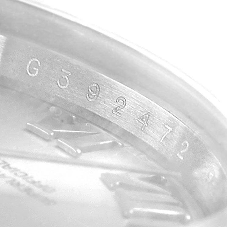 This image shows the engraved serial number inside the bezel of a Rolex Datejust 179174 Women's Stainless Steel Silver Dial 179174 Women's Stainless Steel Silver Dial watch.