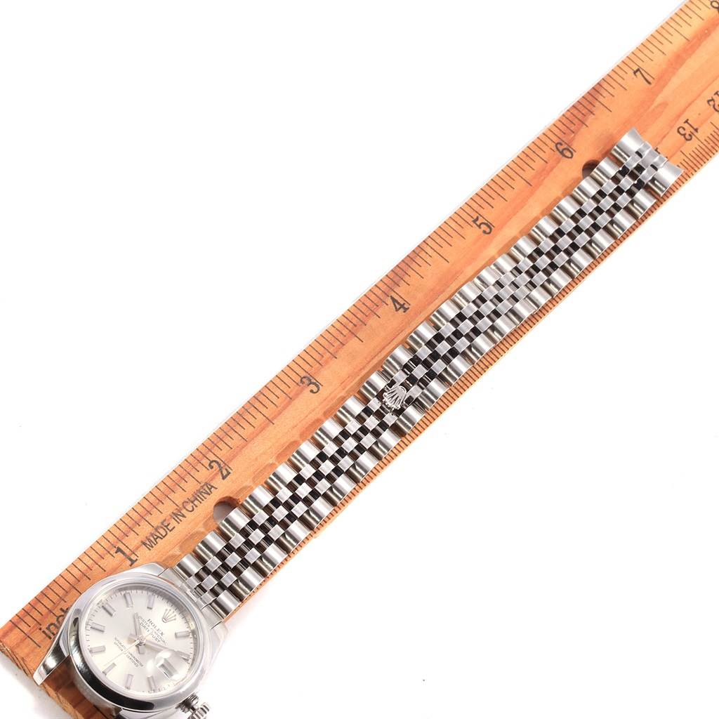 The Rolex Datejust 179160 Women's Stainless Steel Silver Dial 179160 Women's Stainless Steel Silver Dial watch is shown from above, featuring the face and entire bracelet alongside a ruler for measurement.