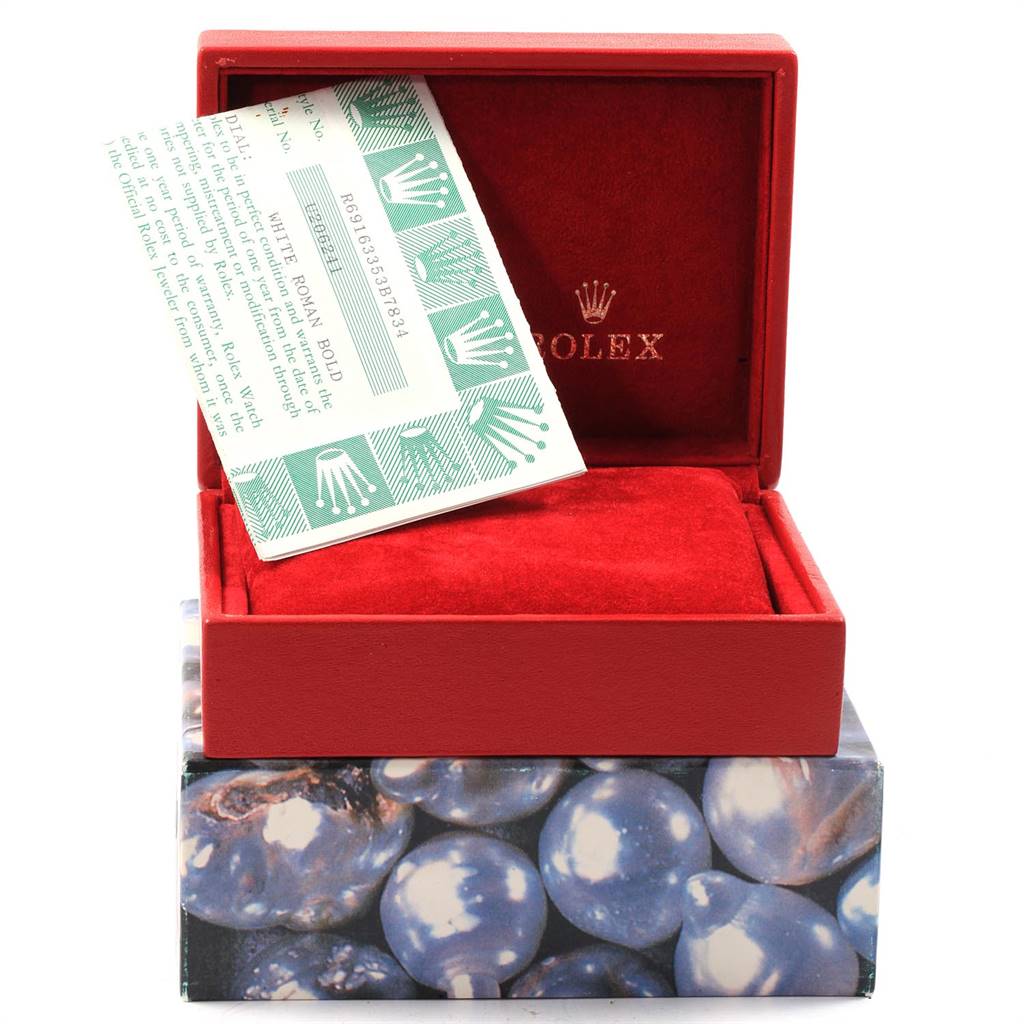 The image shows a Rolex Datejust 69163 Women's Steel and Gold (two tone) White Dial 69163 Women's Steel and Gold (two tone) White Dial box and warranty card, with the box open to reveal a red interior.