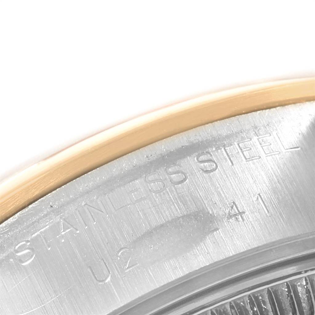 The image shows a close-up of the case back edge of a Rolex Datejust 69163 Women's Steel and Gold (two tone) White Dial 69163 Women's Steel and Gold (two tone) White Dial watch, highlighting the text "STAINLESS STEEL."