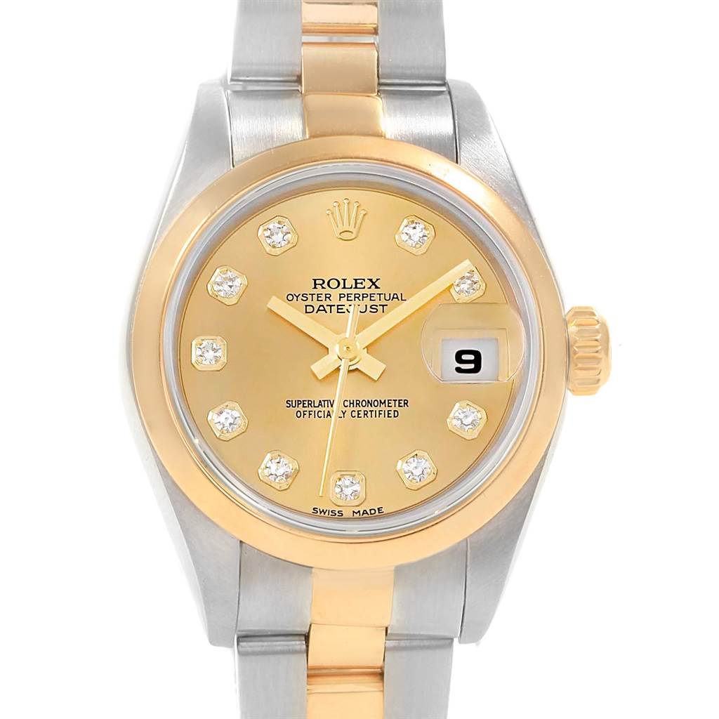 The image shows a front view of a Rolex Datejust 79163 Women's Steel and Gold (two tone) Champagne Dial 79163 Women's Steel and Gold (two tone) Champagne Dial watch, highlighting the gold dial, diamond hour markers, and date window.
