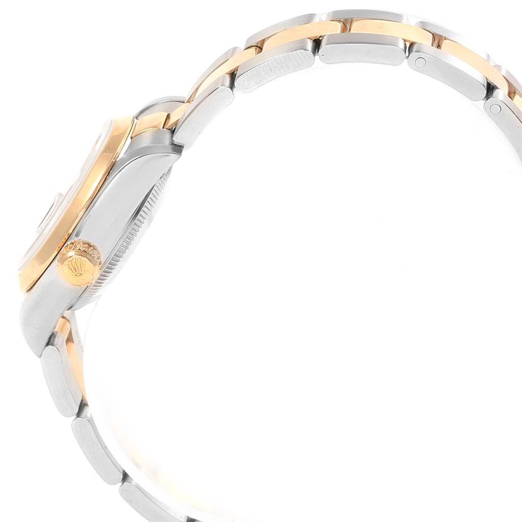 The image shows a side view of a Rolex Datejust 79163 Women's Steel and Gold (two tone) Champagne Dial 79163 Women's Steel and Gold (two tone) Champagne Dial watch highlighting the two-tone bracelet and the crown.