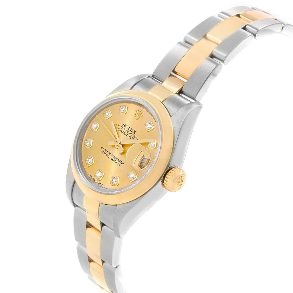 The image shows a Rolex Datejust 79163 Women's Steel and Gold (two tone) Champagne Dial 79163 Women's Steel and Gold (two tone) Champagne Dial watch angled from the top right, highlighting its dial, bezel, and two-tone bracelet.