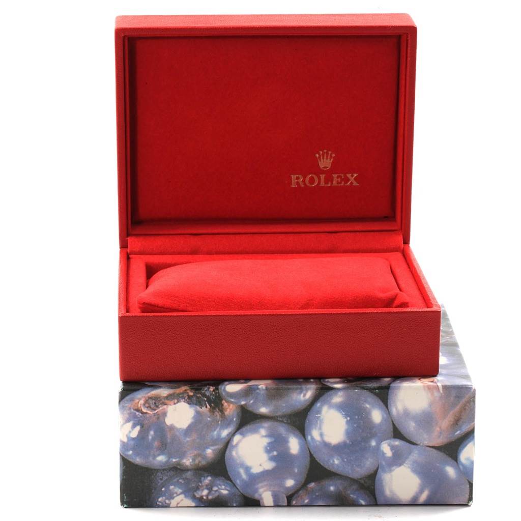 This image shows an open red watch box for the Rolex Datejust 79163 Women's Steel and Gold (two tone) Champagne Dial 79163 Women's Steel and Gold (two tone) Champagne Dial model.