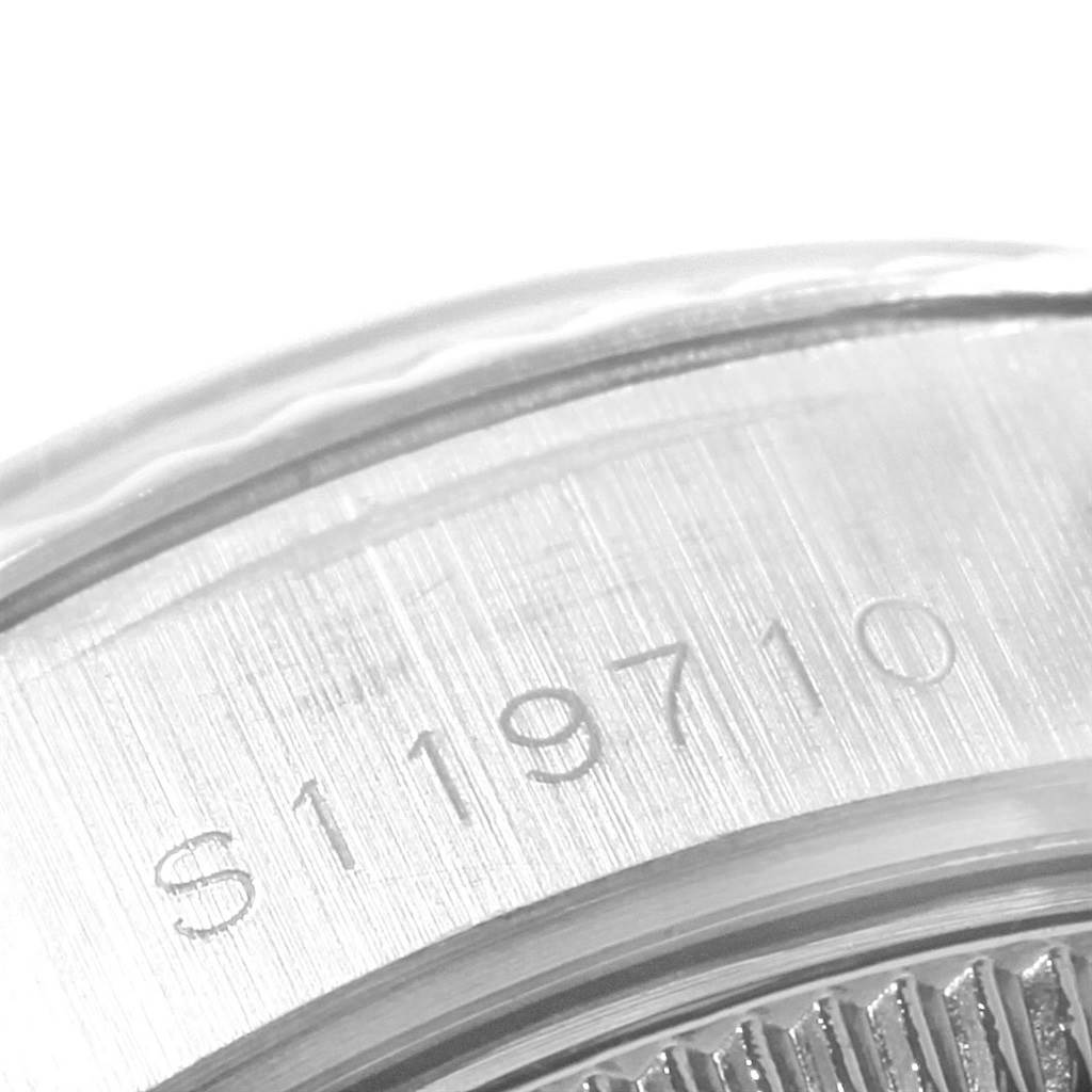 This image shows a close-up of the serial number engraved on the side of the Rolex Datejust 69174 Women's Stainless Steel Silver Dial 69174 Women's Stainless Steel Silver Dial model.