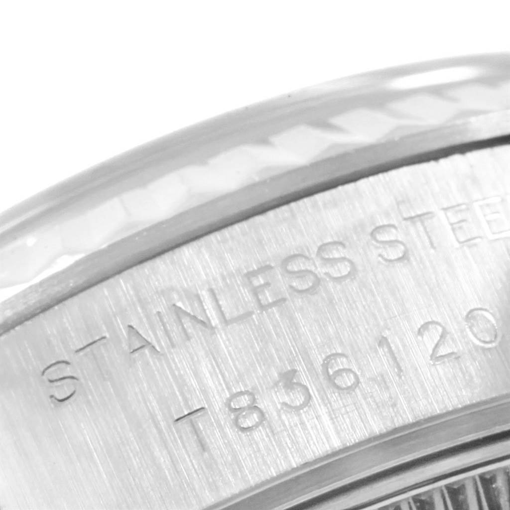 The image shows a close-up angle of the case back of a Rolex Datejust 69174 Women's Stainless Steel Blue Dial 69174 Women's Stainless Steel Blue Dial, highlighting the stainless steel engraving.