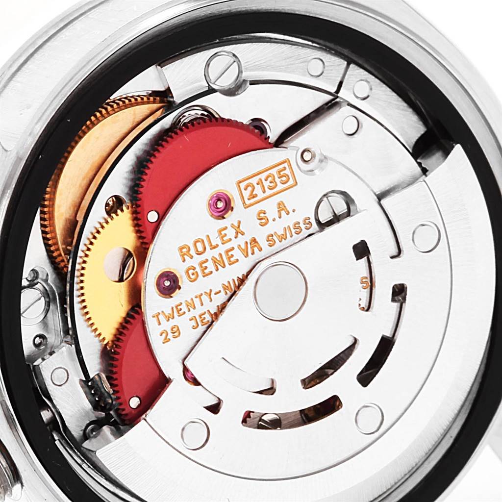 The image shows the internal movement mechanism of a Rolex Datejust 69174 Women's Stainless Steel Blue Dial 69174 Women's Stainless Steel Blue Dial watch, including gears and the rotor marked "2135."