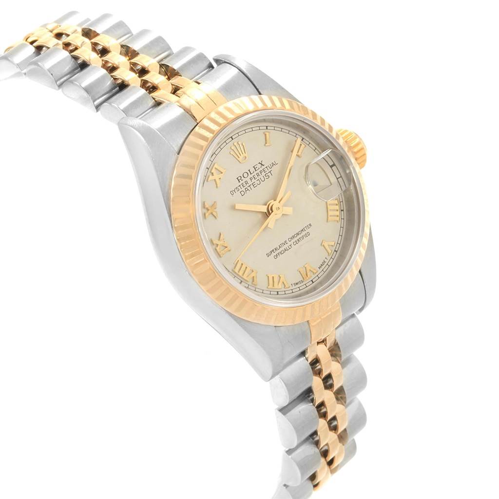 This image of a Rolex Datejust 69173 Women's Stainless Steel Beige Dial 69173 Women's Stainless Steel Beige Dial watch shows a side angle featuring the face, bezel, dial, and two-tone bracelet.
