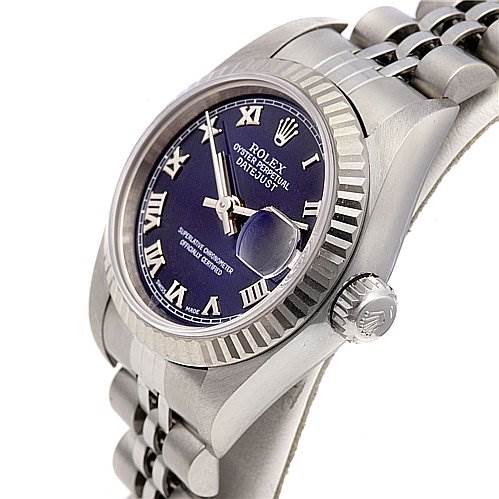 The image shows a side angle of a Rolex Datejust 79174 Women's Stainless Steel Blue Dial 79174 Women's Stainless Steel Blue Dial watch, highlighting the dial, fluted bezel, and Jubilee bracelet.
