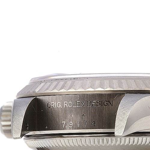 The image shows a side view of the Rolex Datejust 79174 Women's Stainless Steel Blue Dial 79174 Women's Stainless Steel Blue Dial watch, focusing on the case side engraved with "ORIG. ROLEX DESIGN" and the model number.