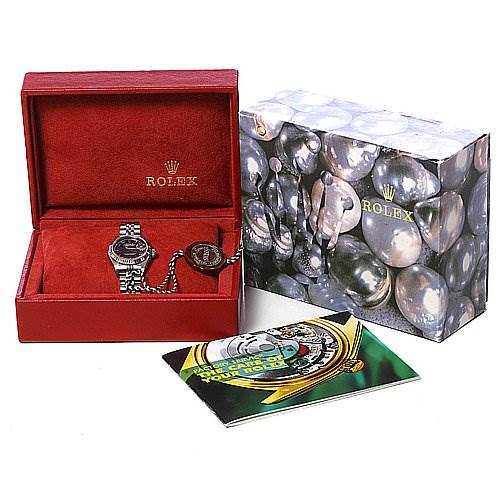 The image shows a Rolex Datejust 79174 Women's Stainless Steel Blue Dial 79174 Women's Stainless Steel Blue Dial watch in a red box, alongside its outer decorative box and manuals.