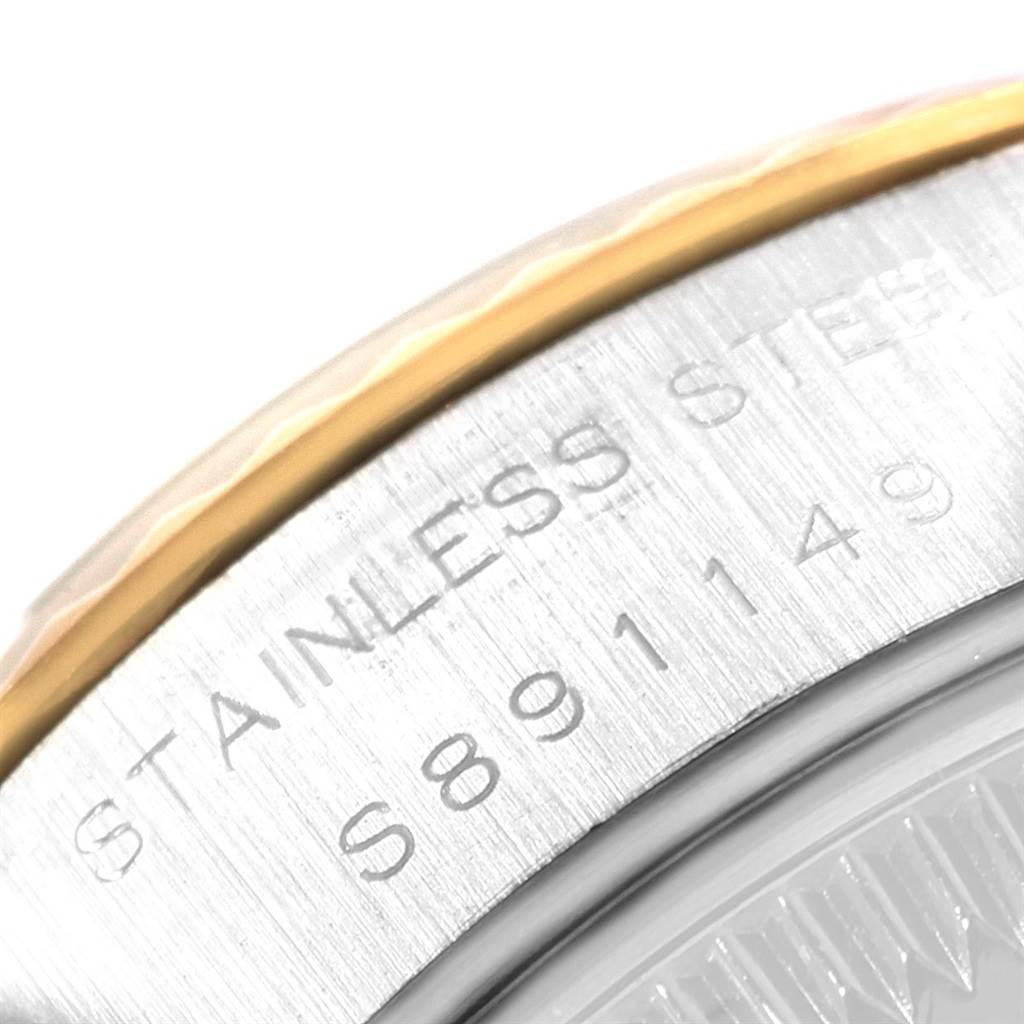 The image shows a close-up of the serial number and part of the stainless steel casing of a Rolex Datejust 69173 Women's Stainless Steel White Dial 69173 Women's Stainless Steel White Dial watch.