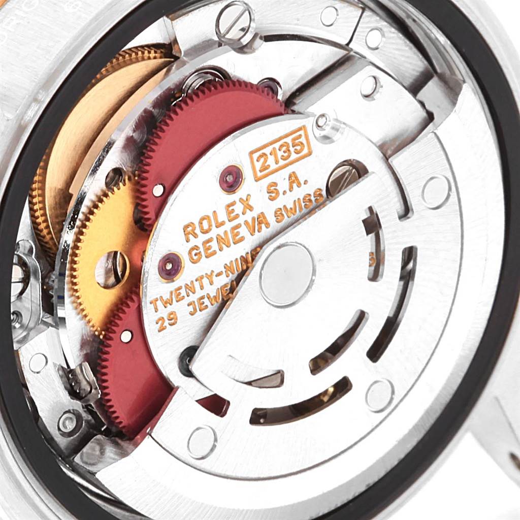 The image shows the inner mechanical movement of a Rolex Datejust 69173 Women's Stainless Steel White Dial 69173 Women's Stainless Steel White Dial watch, highlighting its intricate components and gears.