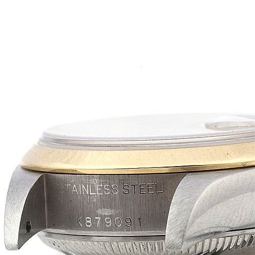 The image shows a side view of the Rolex Datejust 79163 Women's Yellow Gold Champagne Dial 79163 Women's Yellow Gold Champagne Dial watch case, highlighting the stainless steel material and partial serial number.