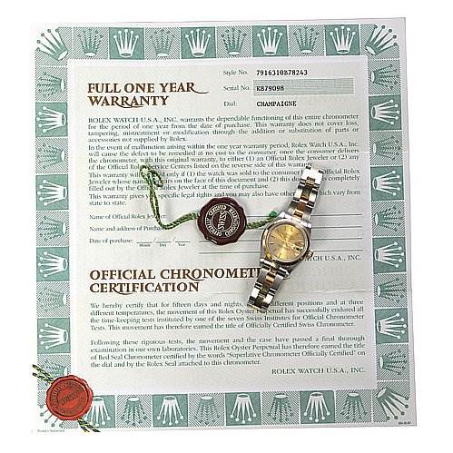 The image shows a Rolex Datejust 79163 Women's Yellow Gold Champagne Dial 79163 Women's Yellow Gold Champagne Dial watch from a top-down angle, along with its warranty and certification documents.