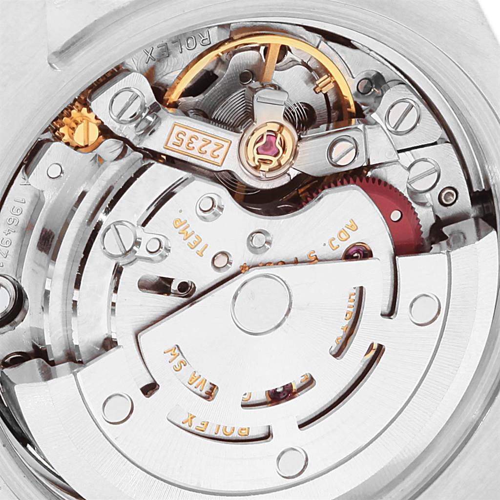 This image shows a close-up of the Rolex Datejust 179173 Women's Steel and Gold (two tone) Mother of Pearl Dial 179173 Women's Steel and Gold (two tone) Mother of Pearl Dial watch's automatic movement mechanism, highlighting its intricate parts.