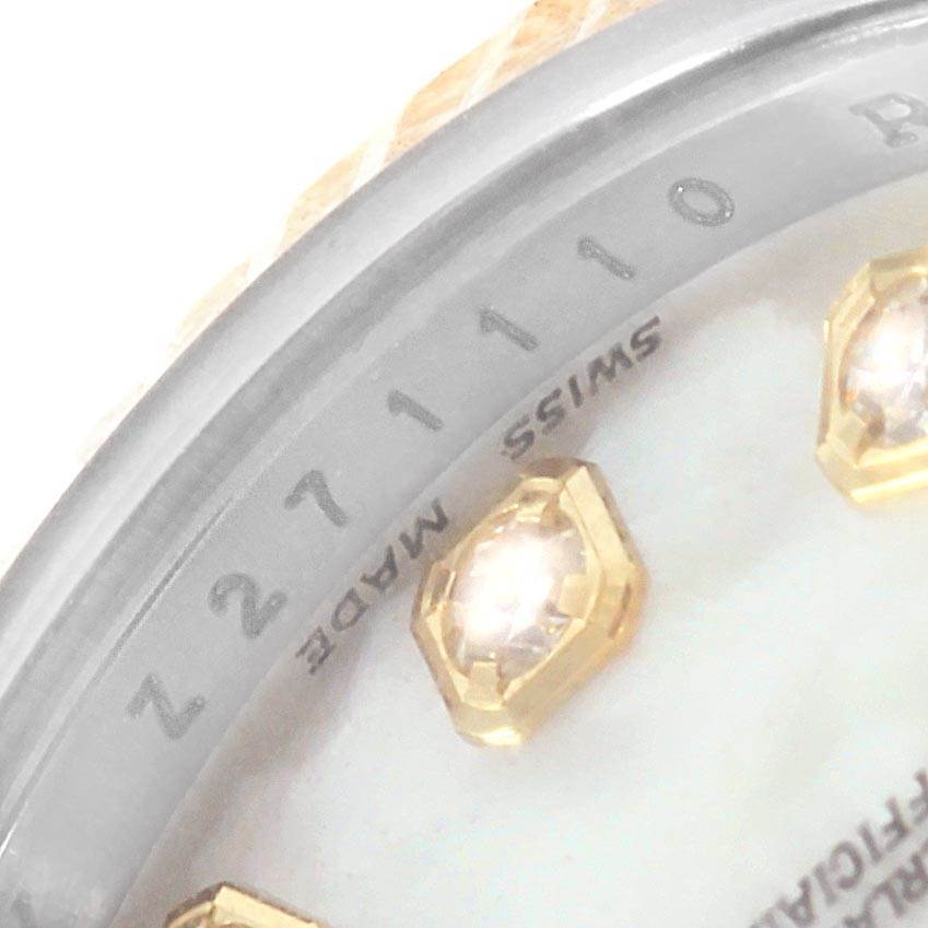 The image shows a close-up of the dial and serial number area of a Rolex Datejust 179173 Women's Steel and Gold (two tone) Mother of Pearl Dial 179173 Women's Steel and Gold (two tone) Mother of Pearl Dial, including diamond markers and part of the bezel.