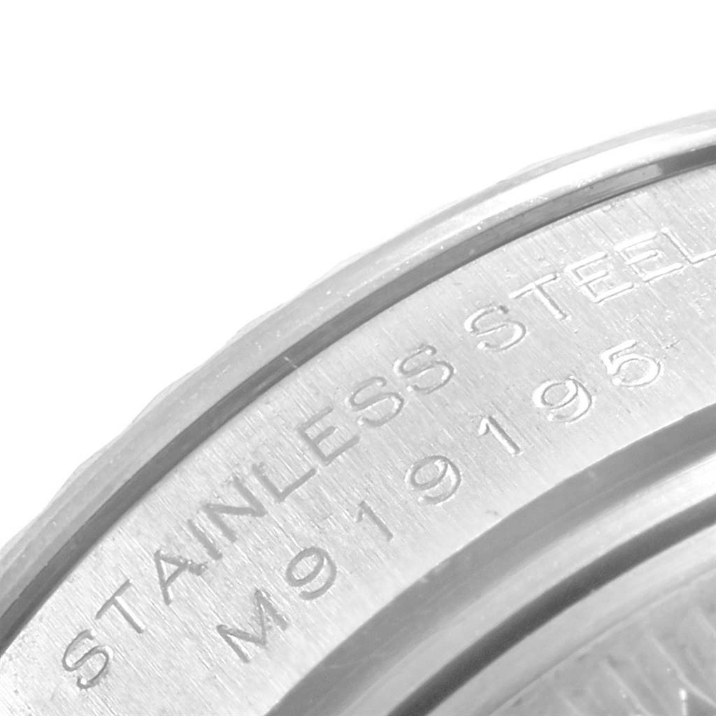 The image shows a close-up of the stainless steel case back of a Rolex Datejust 179174 Women's Stainless Steel Mother of Pearl Dial 179174 Women's Stainless Steel Mother of Pearl Dial watch, highlighting engraved details.