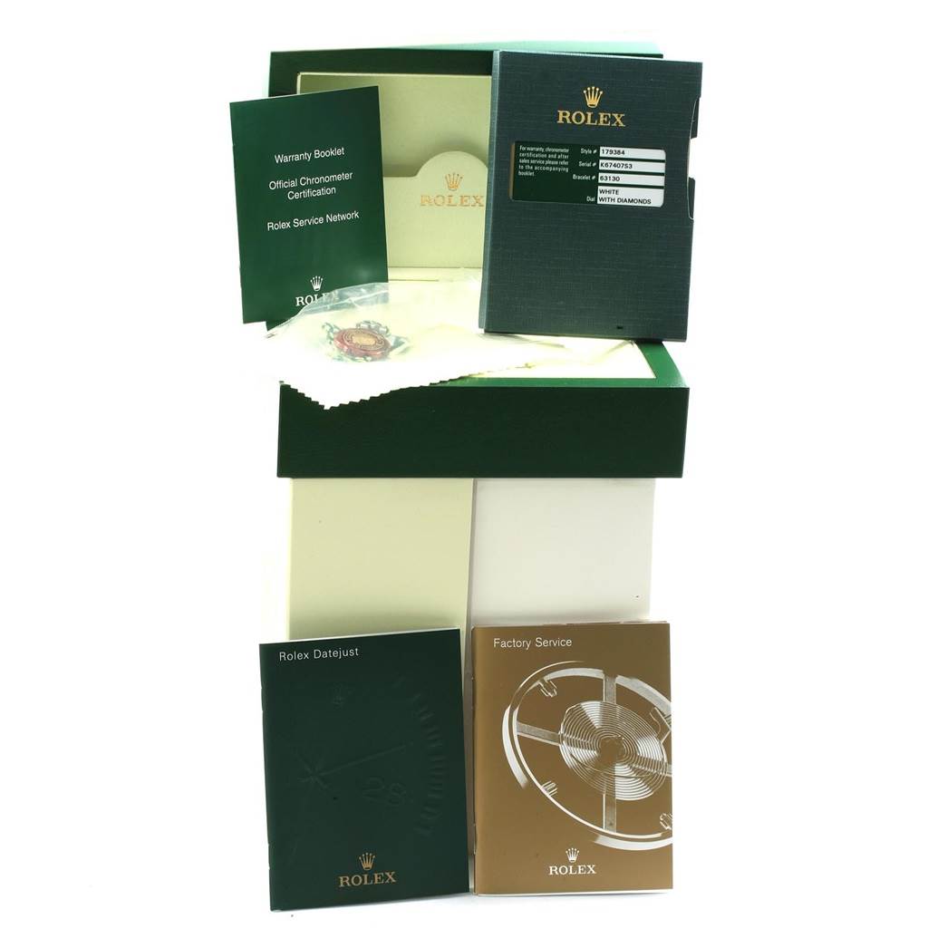 The image shows accessories for a Rolex Datejust 179384 Women's Stainless Steel White Dial 179384 Women's Stainless Steel White Dial watch, including boxes, booklets, a warranty card, and a cleaning cloth.