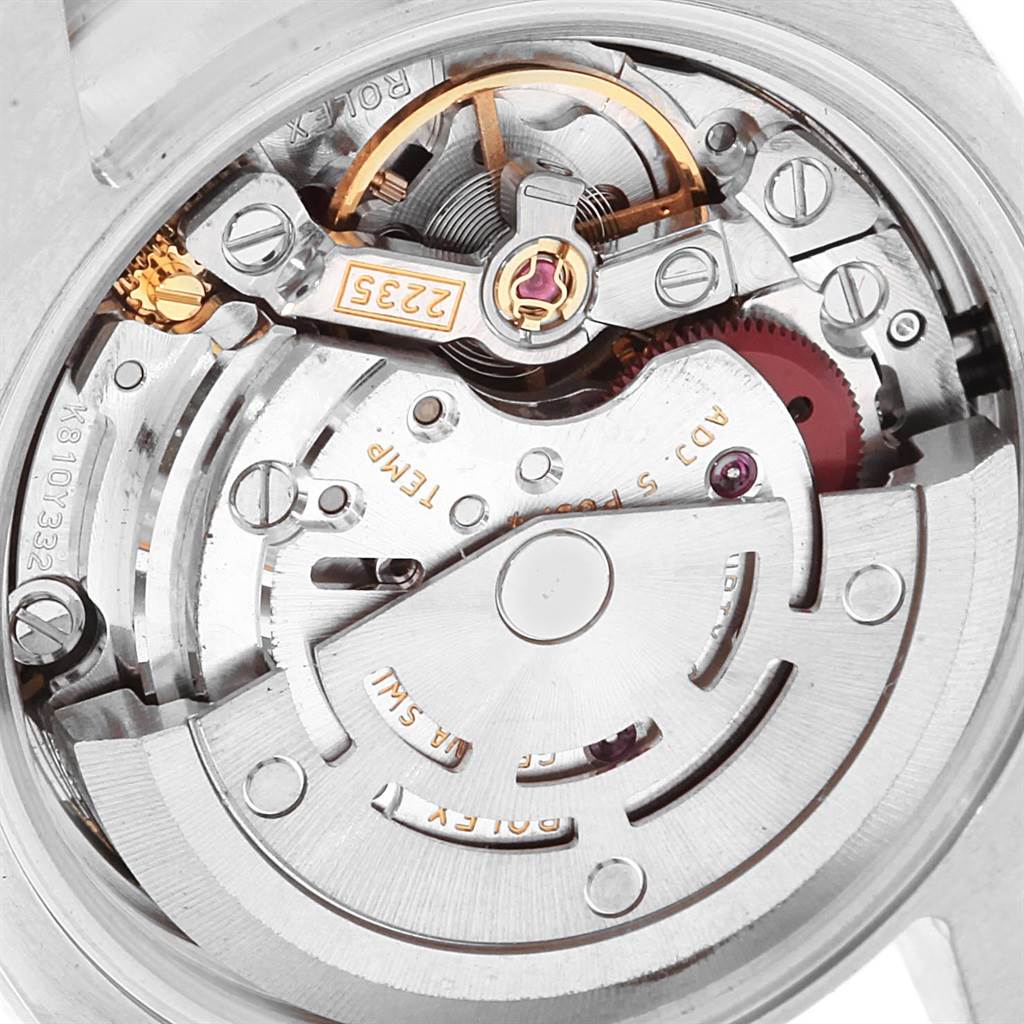 The image shows a close-up view of the Rolex Datejust 179384 Women's Stainless Steel White Dial 179384 Women's Stainless Steel White Dial watch's movement, specifically its intricate automatic mechanism.