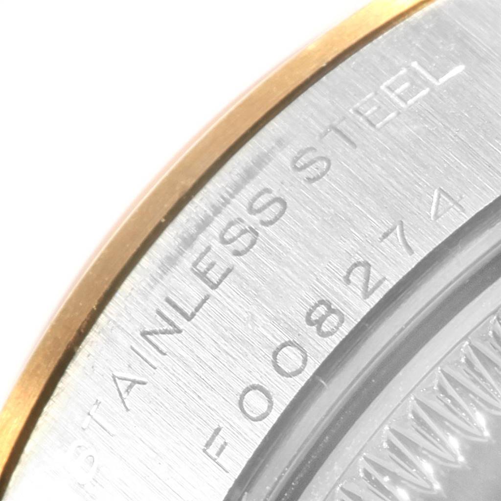 This close-up image shows the engraved stainless steel back of a Rolex Datejust 79163 Women's Steel and Gold (two tone) Silver Dial 79163 Women's Steel and Gold (two tone) Silver Dial watch, highlighting the serial number and part of the case.