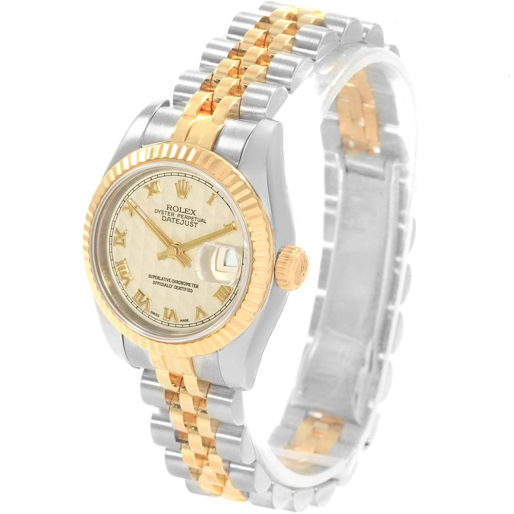The image shows a side angle of the Rolex Datejust 179173 Women's Steel and Gold (two tone) Beige Dial 179173 Women's Steel and Gold (two tone) Beige Dial, displaying the watch face, gold bezel, and two-tone metal bracelet.