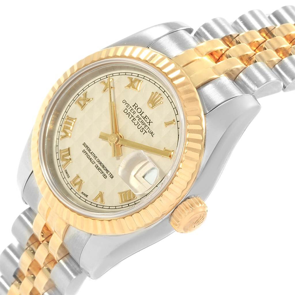 This Rolex Datejust 179173 Women's Steel and Gold (two tone) Beige Dial 179173 Women's Steel and Gold (two tone) Beige Dial watch is shown at an angle displaying the face, bezel, crown, and part of the bracelet.