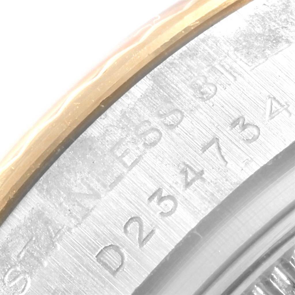 This image shows a close-up of the side engraving and bezel of the Rolex Datejust 179173 Women's Steel and Gold (two tone) Beige Dial 179173 Women's Steel and Gold (two tone) Beige Dial model.