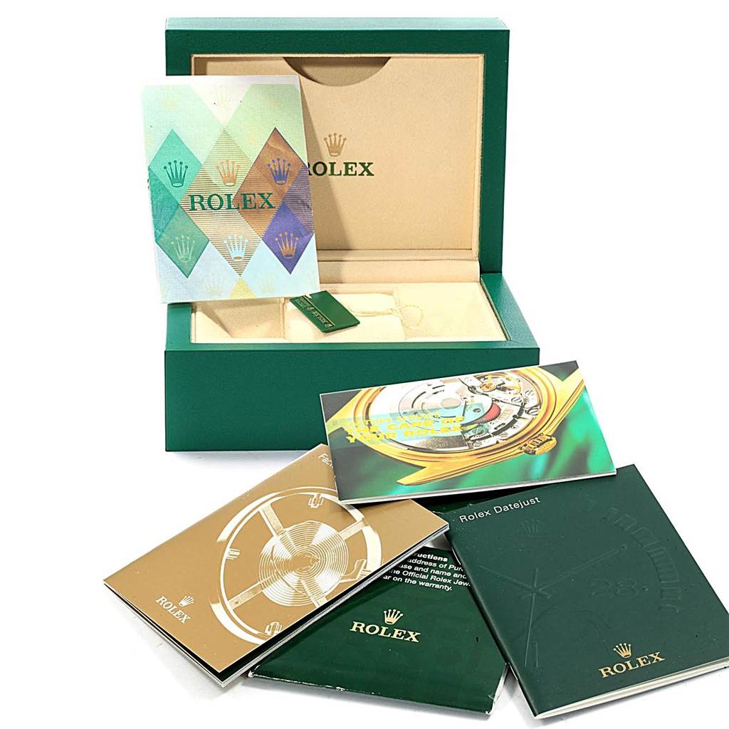 This image shows the packaging and accompanying booklets for a Rolex Datejust 179173 Women's Steel and Gold (two tone) Beige Dial 179173 Women's Steel and Gold (two tone) Beige Dial watch, including the box and several pamphlets.