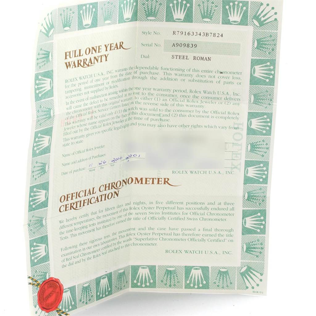 This image shows a close-up of the warranty and certification documents for a Rolex Datejust 79163 Women's Steel and Gold (two tone) Grey Dial 79163 Women's Steel and Gold (two tone) Grey Dial watch.