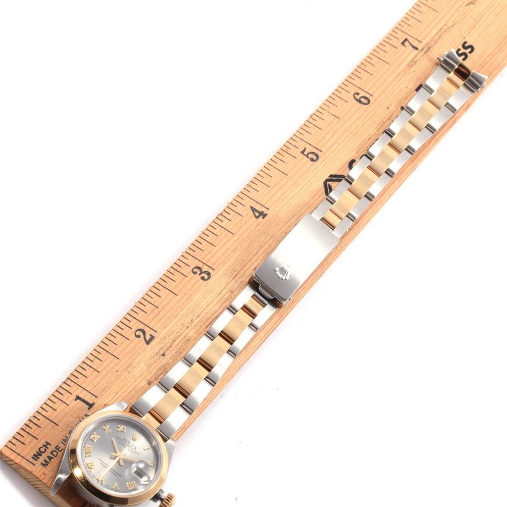 The image shows a Rolex Datejust 79163 Women's Steel and Gold (two tone) Grey Dial 79163 Women's Steel and Gold (two tone) Grey Dial watch measured against a ruler, highlighting its metal bracelet and clasp.
