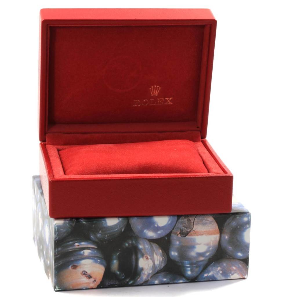 This image shows a red Rolex Datejust 79163 Women's Steel and Gold (two tone) Grey Dial 79163 Women's Steel and Gold (two tone) Grey Dial watch box, open and empty, displaying the brand's logo inside the lid.