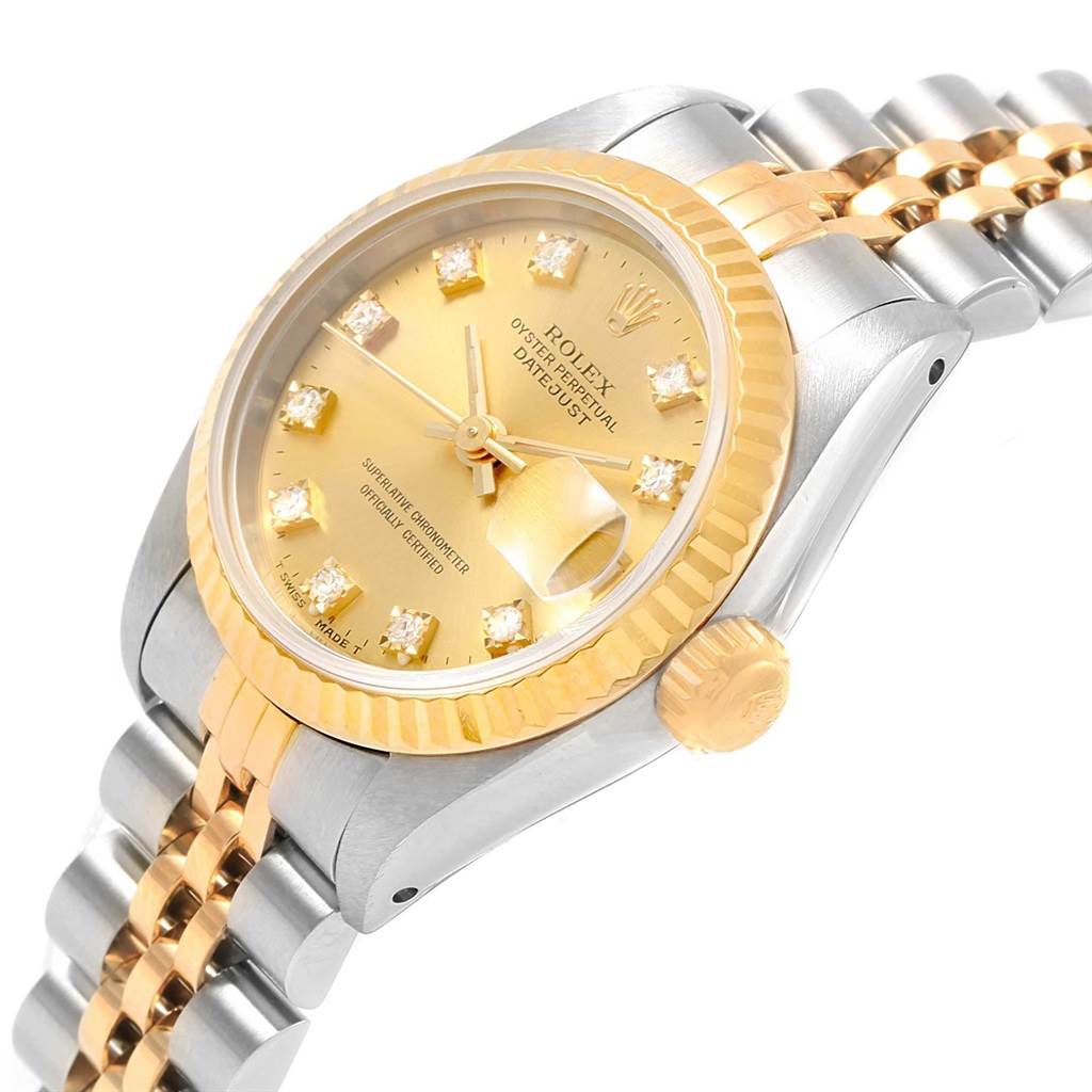 The image shows a Rolex Datejust 69173 Women's Stainless Steel Champagne Dial 69173 Women's Stainless Steel Champagne Dial watch from a three-quarter angle, highlighting the gold dial, fluted bezel, and two-tone bracelet.