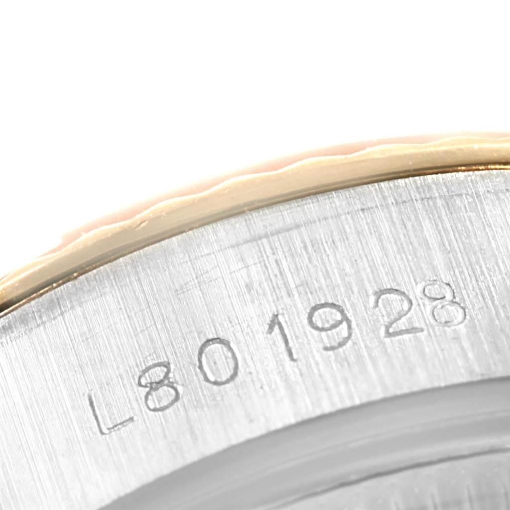 This close-up image shows the serial number engraved on the case back of a Rolex Datejust 69173 Women's Stainless Steel Champagne Dial 69173 Women's Stainless Steel Champagne Dial watch.