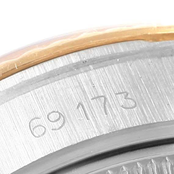 Close-up view of the case back's engraved serial number on a Rolex Datejust 69173 Women's Stainless Steel Champagne Dial 69173 Women's Stainless Steel Champagne Dial.