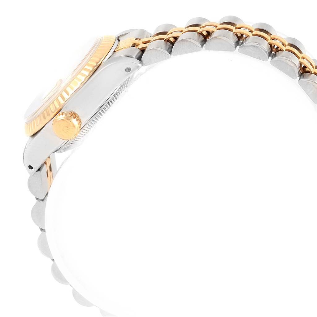 This image shows a side view of the case and bracelet of a Rolex Datejust 69173 Women's Stainless Steel Champagne Dial 69173 Women's Stainless Steel Champagne Dial watch, highlighting the crown and fluted bezel.