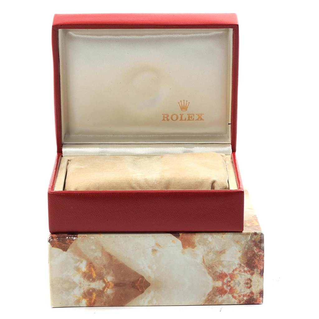 The image shows an open Rolex Datejust 69173 Women's Stainless Steel Champagne Dial 69173 Women's Stainless Steel Champagne Dial watch box, highlighting the interior and a pillow covered by a cloth. 