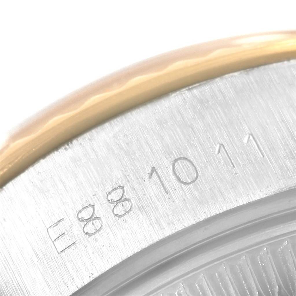 Close-up of the bezel and case side, showing serial numbers, of a Rolex Datejust 69173 Women
s Stainless Steel Champagne Dial 69173 Women
s Stainless Steel Champagne Dial watch.