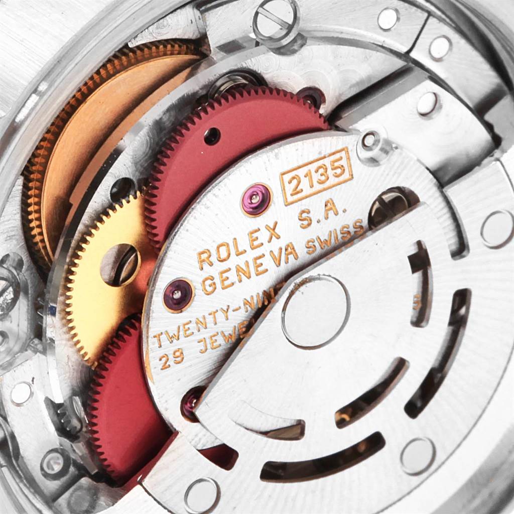 This image shows a close-up of the Rolex Datejust 69173 Women
s Stainless Steel Champagne Dial 69173 Women
s Stainless Steel Champagne Dial movement mechanism, highlighting gears and parts.