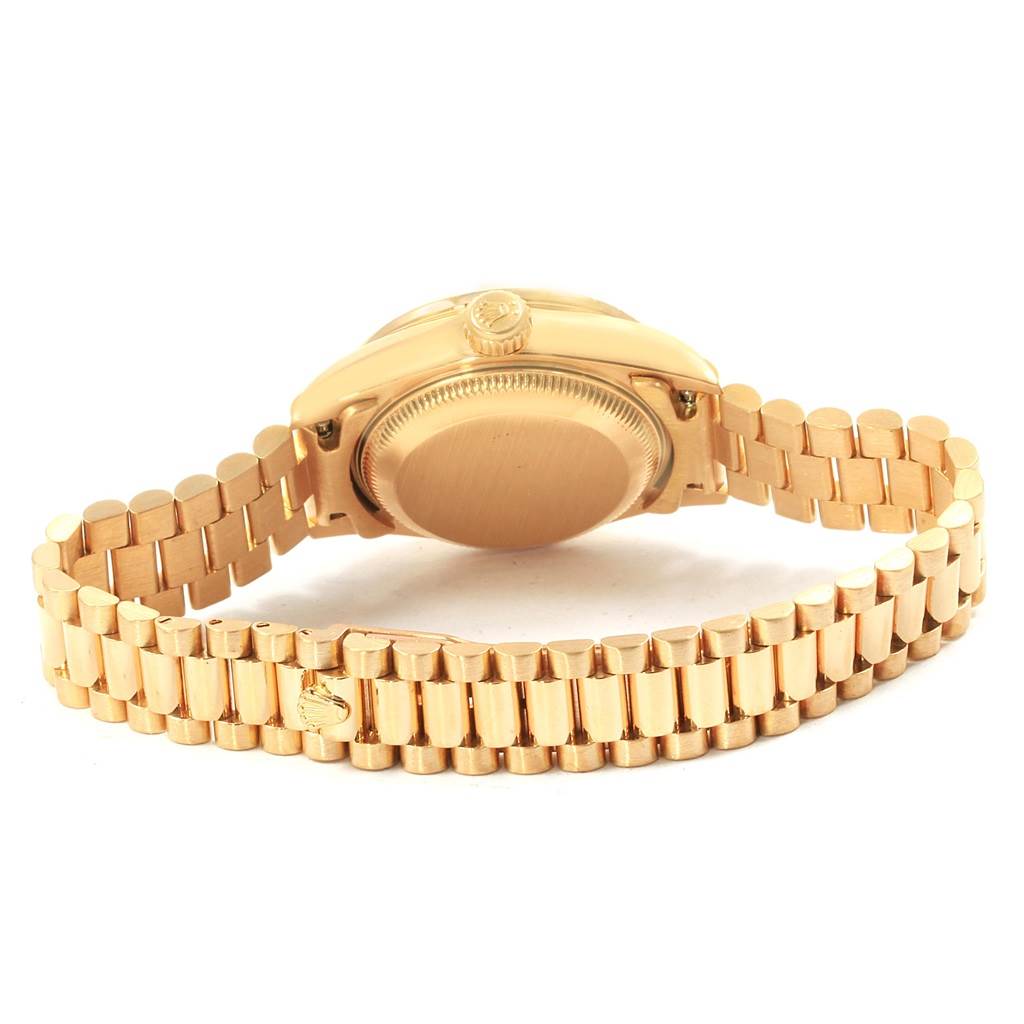 The image shows the back view of the Rolex Datejust 79178 Women's Yellow Gold White Dial 79178 Women's Yellow Gold White Dial watch, highlighting the case back and gold bracelet.