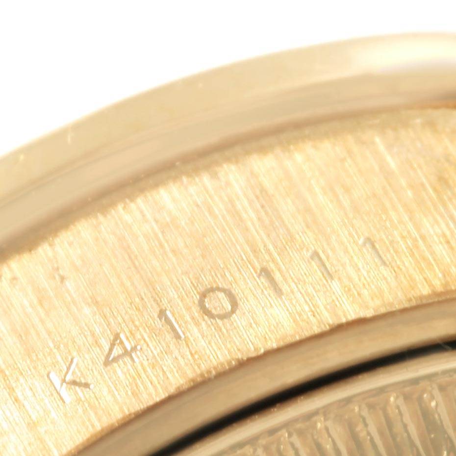 The image shows a close-up angle of the caseback of a Rolex Datejust 79178 Women's Yellow Gold White Dial 79178 Women's Yellow Gold White Dial watch, featuring part of the serial number engraving.
