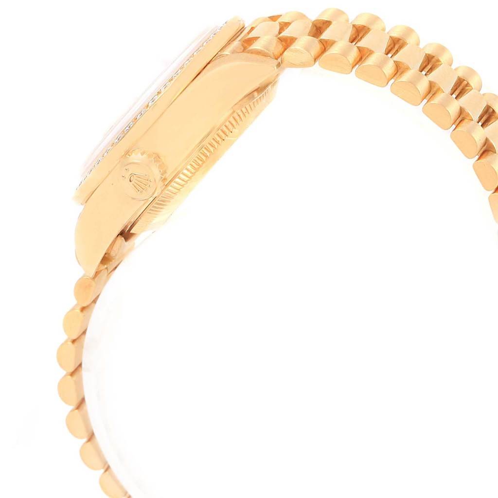 The image shows a side angle of a Rolex Datejust 79178 Women's Yellow Gold White Dial 79178 Women's Yellow Gold White Dial, highlighting the crown and part of the bracelet.