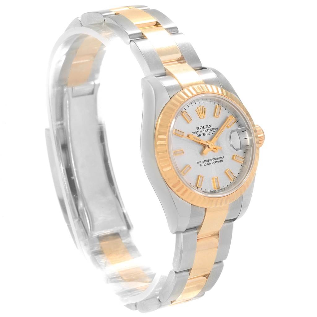 This image shows a side-angle view of a Rolex Datejust 179173 Women's Steel and Gold (two tone) Silver Dial 179173 Women's Steel and Gold (two tone) Silver Dial watch, highlighting the watch face, bezel, and part of the bracelet.