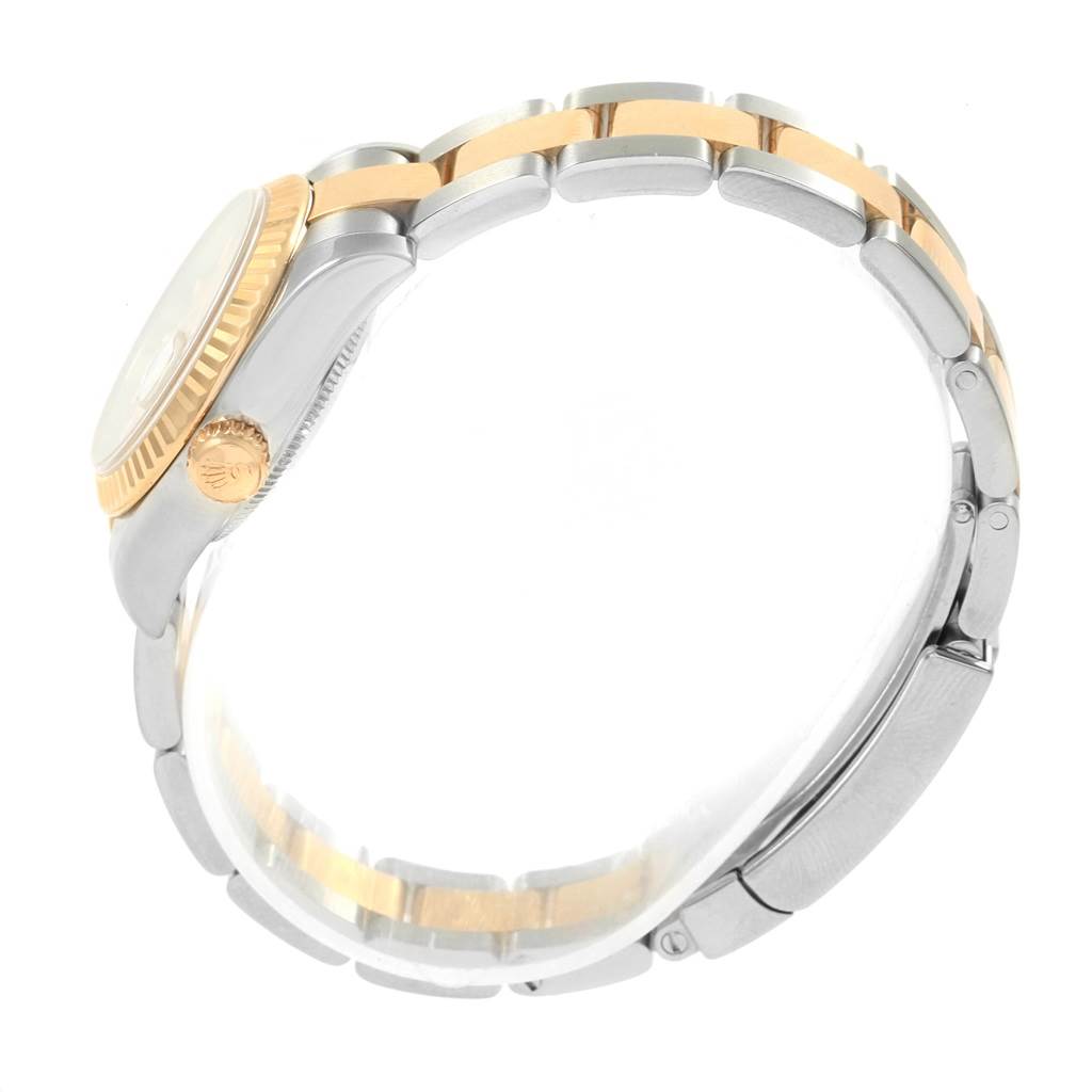 The image shows a side view of a Rolex Datejust 179173 Women's Steel and Gold (two tone) Silver Dial 179173 Women's Steel and Gold (two tone) Silver Dial watch, highlighting the crown, case, and two-tone bracelet.