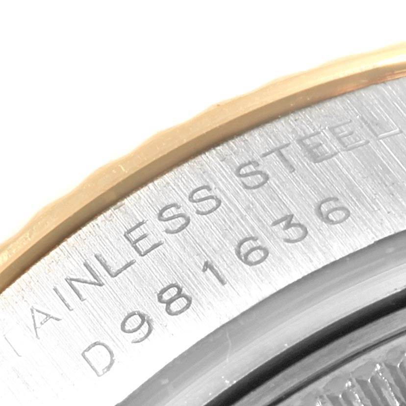 The image shows a close-up of the serial number and "STAINLESS STEEL" engraving on a Rolex Datejust 179173 Women's Steel and Gold (two tone) Silver Dial 179173 Women's Steel and Gold (two tone) Silver Dial watch caseback.