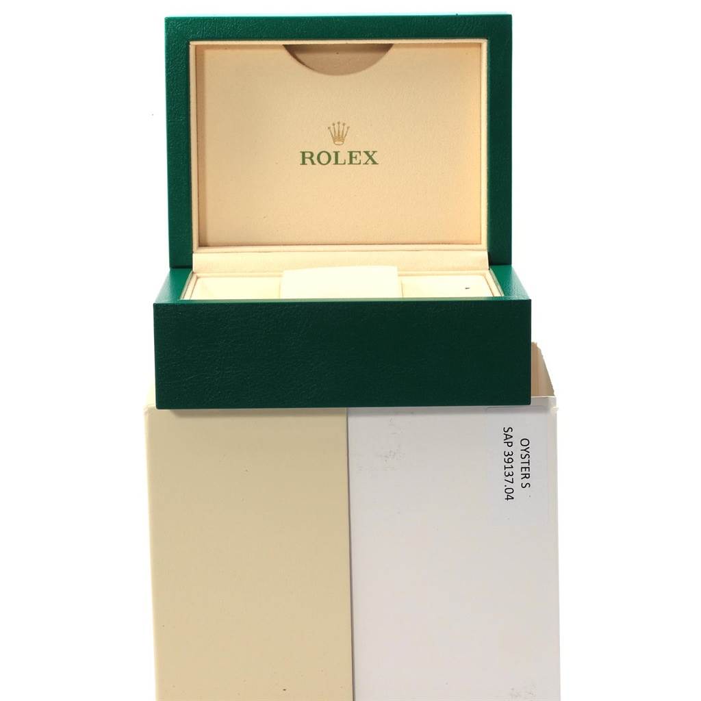 The image shows an opened green and beige Rolex Datejust 179160 Women's Stainless Steel Blue Dial 179160 Women's Stainless Steel Blue Dial watch box with the logo visible inside the lid.